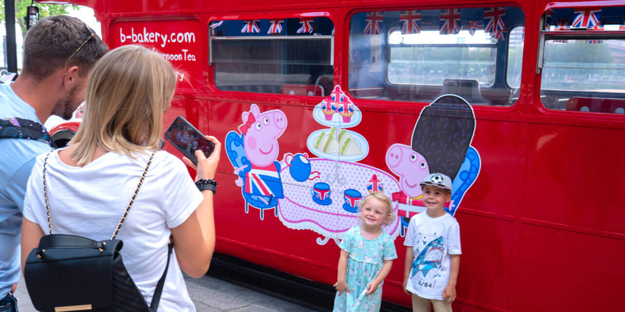 Outside the B Bus with Peppa Pig themed decorations