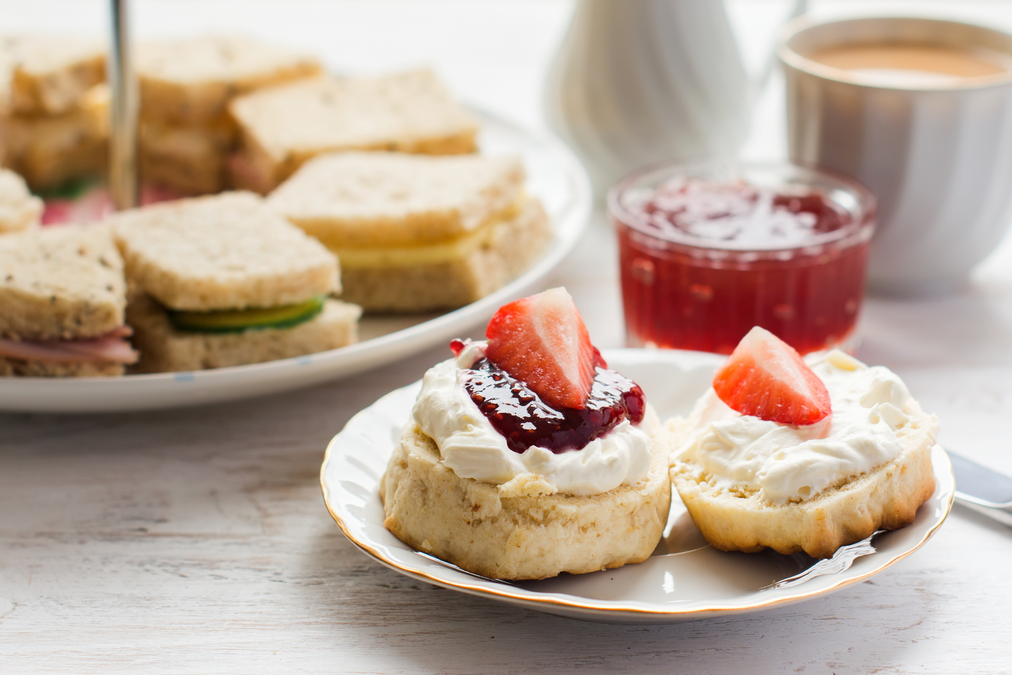 Close up of an Afternoon Tea with scones, sandwiches and tea